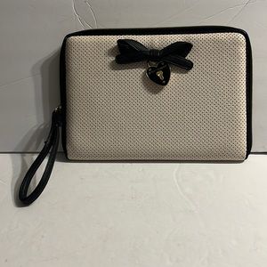 Betsy Johnson clutch purse. Cream with black trim. Black bow. Cute metal heart.